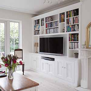 Wide Victorian style alcove cabinet.